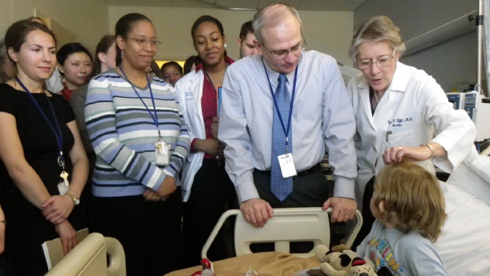 Drs. William Gahl and Cynthia Tifft meet with patients in the NIH Undiagnosed Diseases Program.