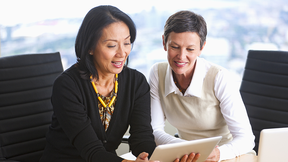 Two middle-aged female professionals