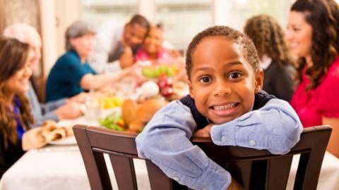 Little boy at Thanksgiving Dinner table